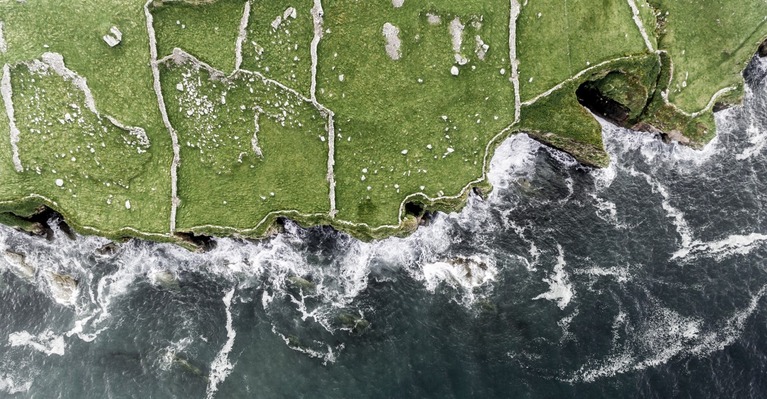 Aerial view of fields cliffs sea